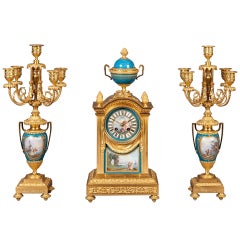 French Mantel Clock and Candelabra of Gilt Bronze and Blue ‘Sèvres’ Porcelain