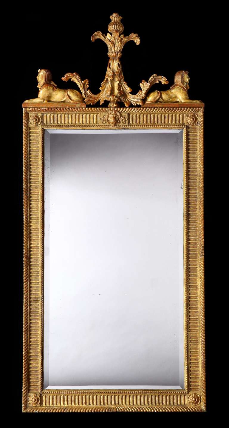 A Pier Mirror in the Manner of the Robert Adam and John Adam

Constructed in carved gilt wood and gesso; the gadroon edged frame having an interior reserve of running arcaded channelling, with rose flower heads at the angles, and a lion’s head