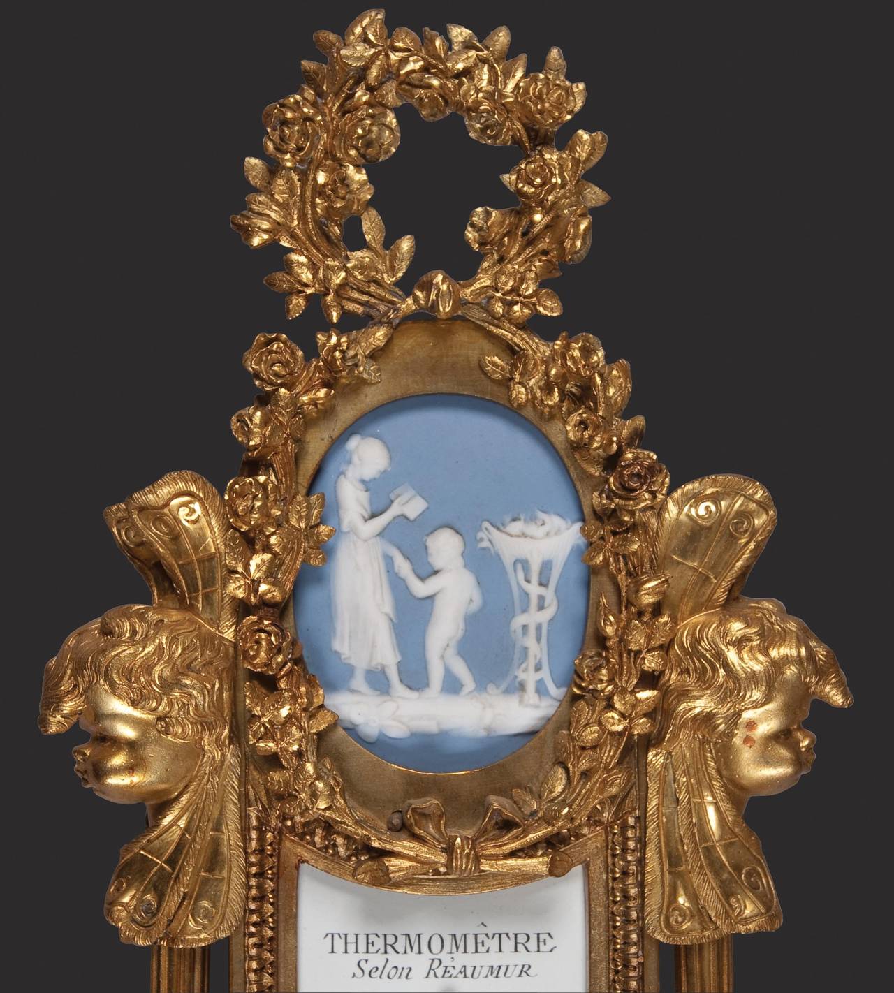 A fine quality clock and barometer set by Carcany and Robin, after models on exhibition in the Louvre Museum, Paris. 

In the Louis XVI manner, of banjo form, the cases being in crisply cast bronze, with ormolu gilding, with Wedgwood type