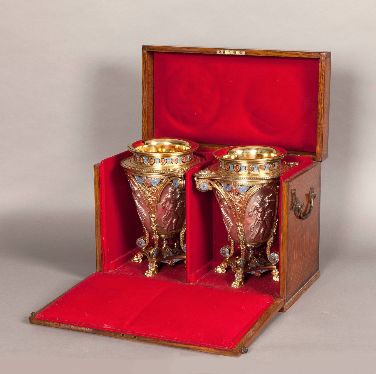 A Magnificent Pair of Parcel Gilt Silver & Enamelled Wine Coolers
From a dessert service exhibited at the 1862 Great Exhibition London
Being made by Elkington & Co

Designed in the ‘Graeco-Pompeian’ manner by A.A. Willms (see below); four claws