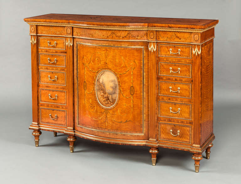 A magnificent side cabinet in the Adam manner, firmly attributed to Wright & Mansfield of London

Constructed in a finely grained and patinated satinwood, cross banded with kingwood, the whole decorated with excellent marquetry work, and fine