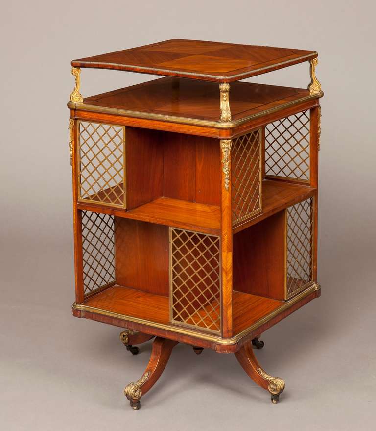 A French revolving library bookcase

Constructed in kingwood, amaranth and goncalo alves, and dressed with high quality gilt bronze work; rising from quadripartite swept and hipped legs dressed with foliate sabots and castors; the two lower