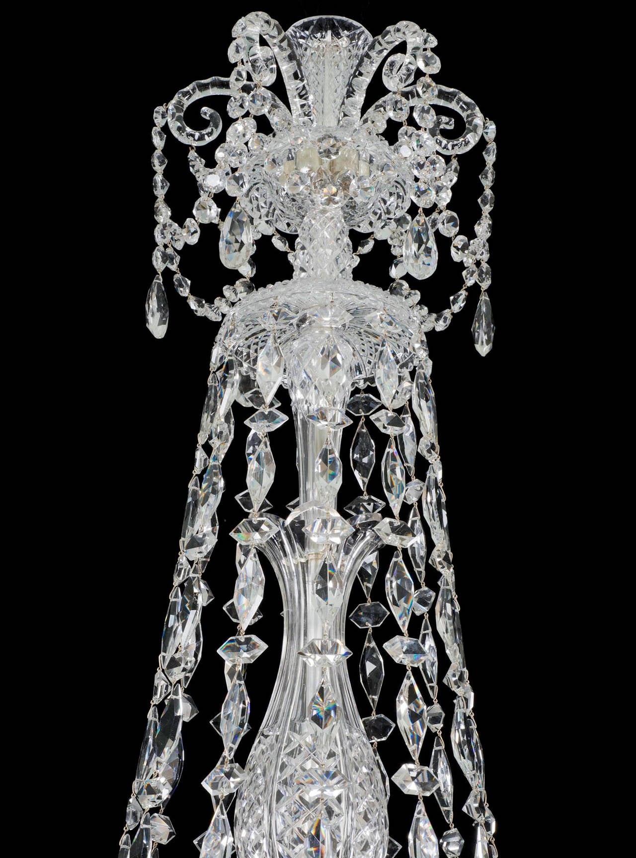 A fine quality Victorian twelve-light cut-glass and silvered mounted chandelier the flat diamond cut baluster stem surmounting by six thumb cut Sheppard crooks terminating with trumpet shaped top piece, the flat diamond cut turnover drop hung