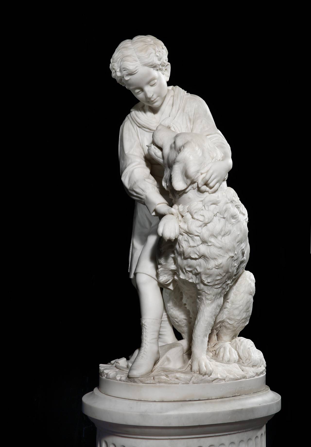 boy with dog statue