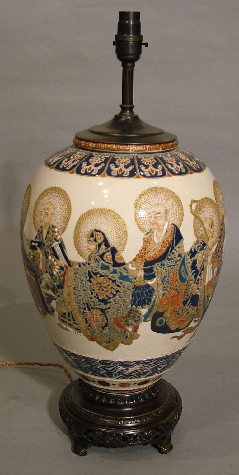 
A very fine antique imperial Satsuma Japanese vase of the Meiji Period

The bulbous form vase, now converted to a lamp, depicts the Ten Arhats, the enlightened disciples of the Buddha, with two young acolytes, delicately and expressively painted