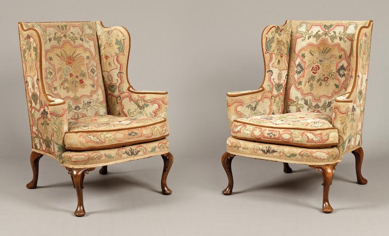 Constructed in walnut, rising from front cabriole legs decorated with ‘c’ scrolls, with swept legs to the rear; upholstered in gros point needlework, in ‘country house’ condition.