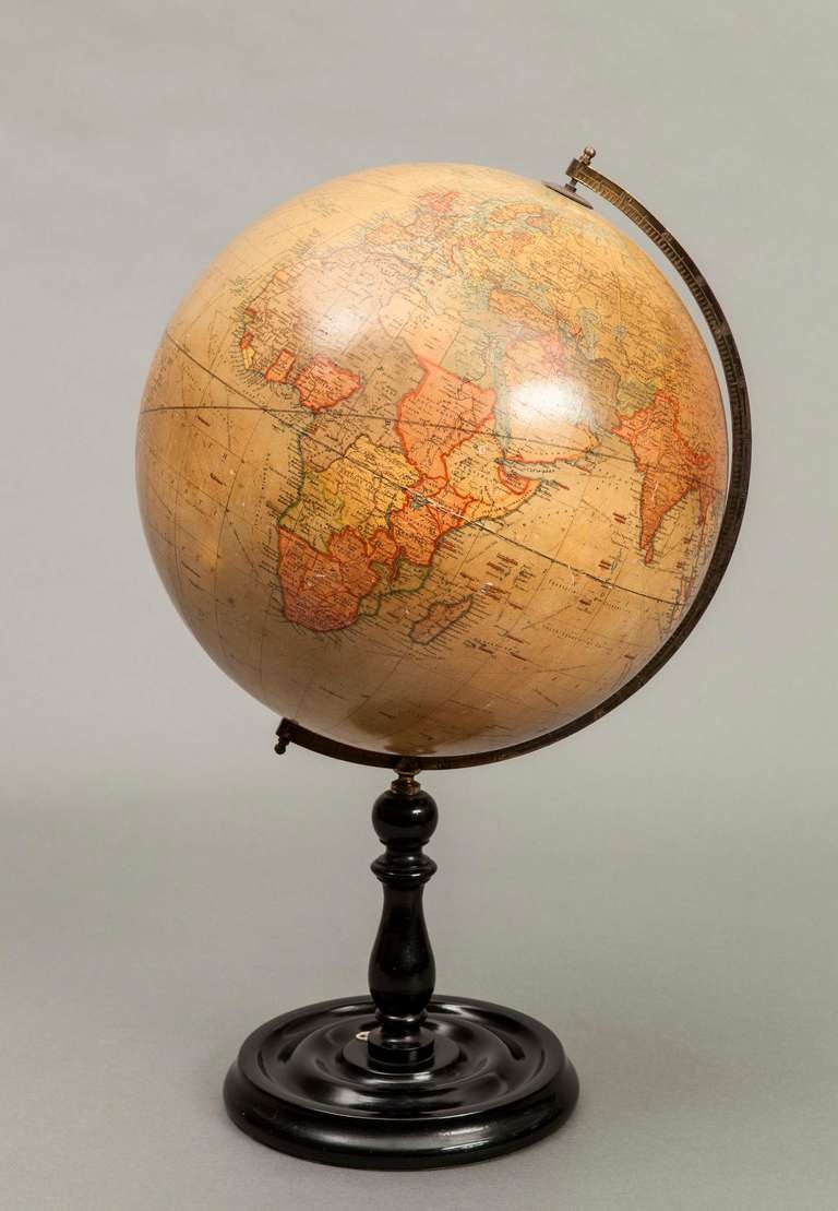 The revolving 12 inch globe, mounted on a dished turned wood stand, and bearing the markers mark, Geographica Ltd, 55 Fleet Street London E.C.4, 1923, and having the retailers label, A.Franks, Opticians, of Deansgate, Manchester. 

Literature: