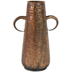 A big size martelé copper jar