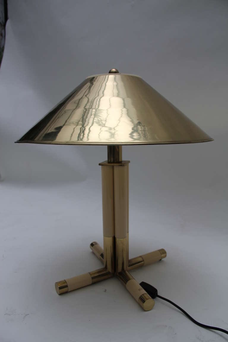 A brass and lacquer table lamp,with brass shade. italy,1970