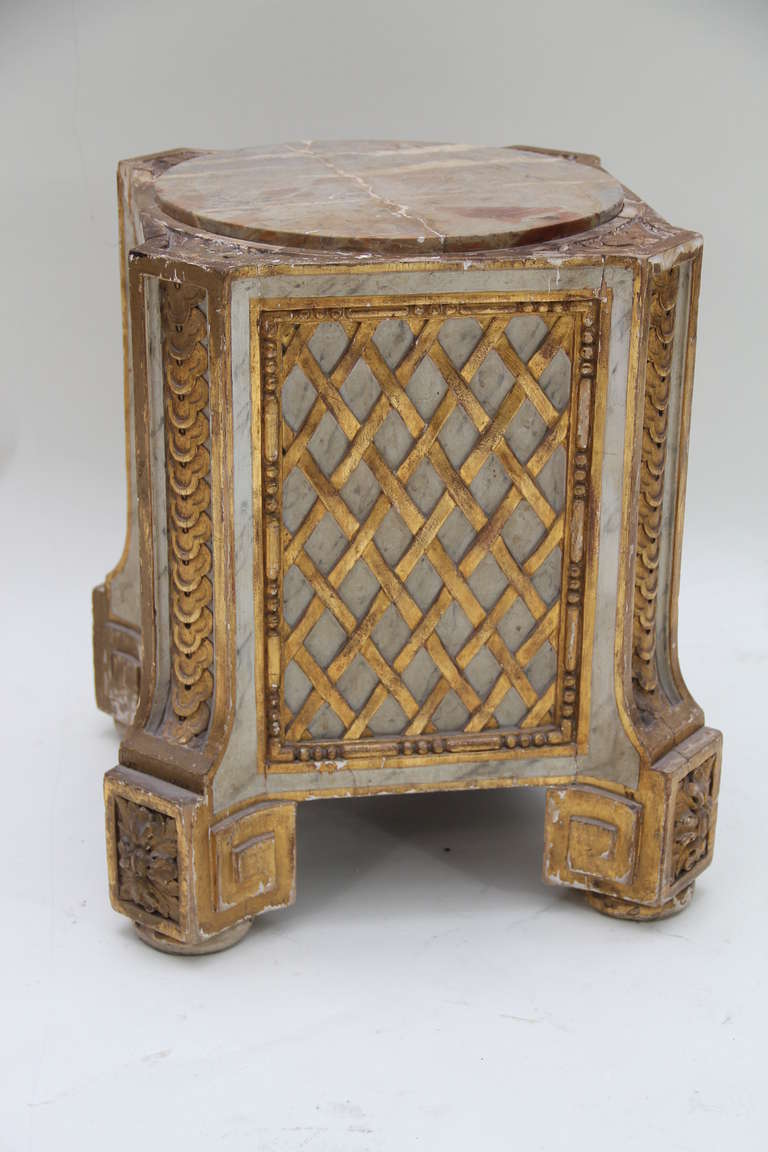 A polychromed and gilt carved wood Louis XVI style pedestal