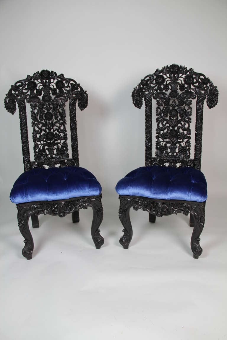 A very complicated foliage carved back with cabriolet legs and friege, in massive black ebony wood chairs