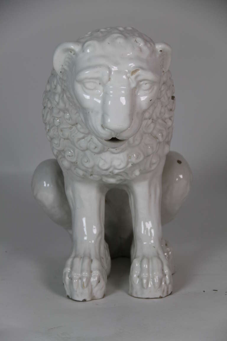 White glazed ceramic sitting male lion