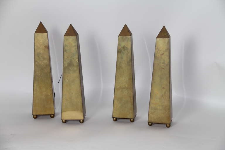 Four gilt brass obelisks attributed to David Hicks