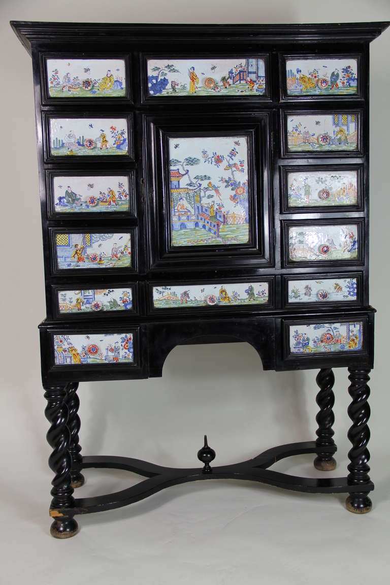 Ebonized wood and famille rose Chinese porcelain cabinet.
 Porcelain from the 18th century