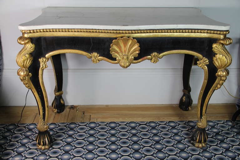 Black And Gilt Pair Of Consoles