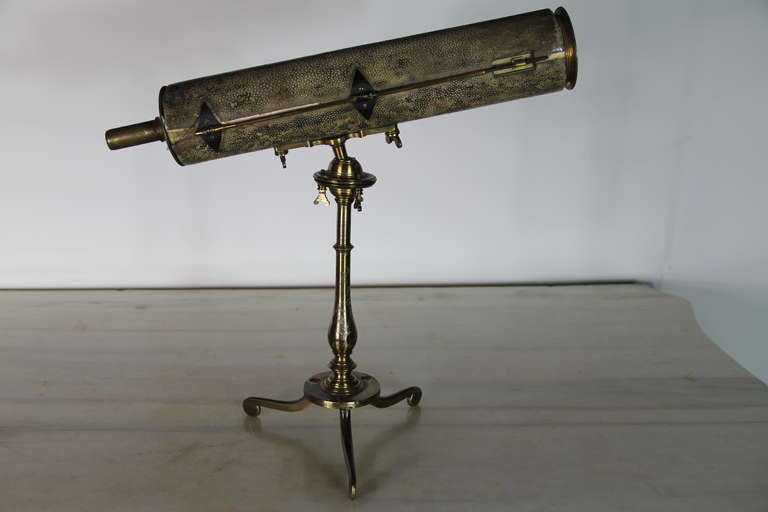 A gilt brass and green shagreen skin telescope on stand, from the collection of the Marques de Salamanca.