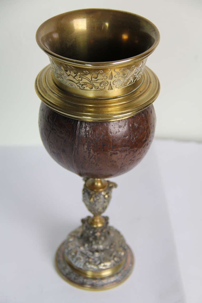 A gilt metal mounted coconut in Baroque style and period decoration,