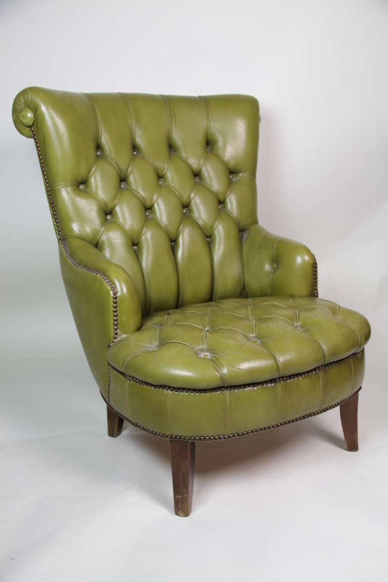 A deep green colour leather capitone upholstered club chair.
England,1950