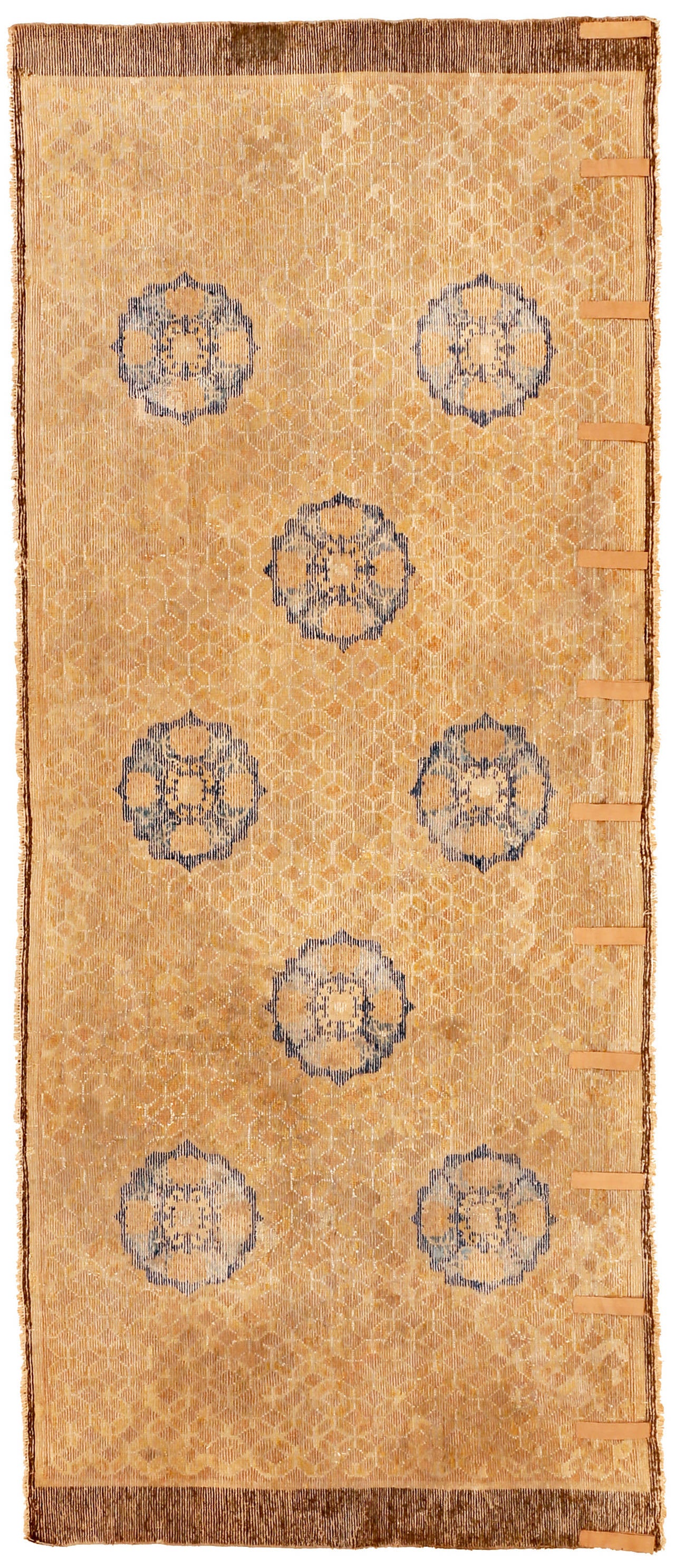 Deacquisitioned many years ago from a small museum in midwest America, this carpet has the rather peculiar feature of being woven along the horizontal axis. The polylobal shape of the medallions is an indication of age and reminds us of the shape of