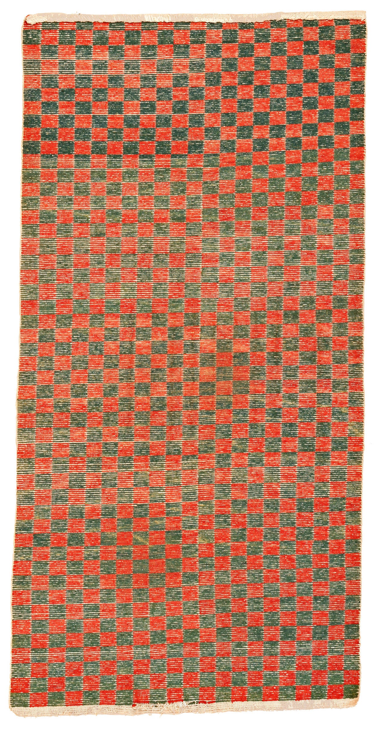 A trophy from my early hunting days in Tibet, this fine chequerboard rug belongs to the earliest group for this type, now almost extinct. The wool is as soft as cashmere and the colours are rich and fully saturated. It adorned for many years the