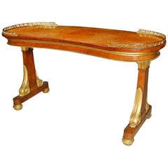 Regency amboyna and giltwood kidney shaped writing table