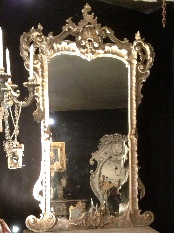 This Italian baroque tall mirror looks precious and It is fabulous on the floor or on a console with many perfumes around...A beautiful light faded gild for a theatre decor...