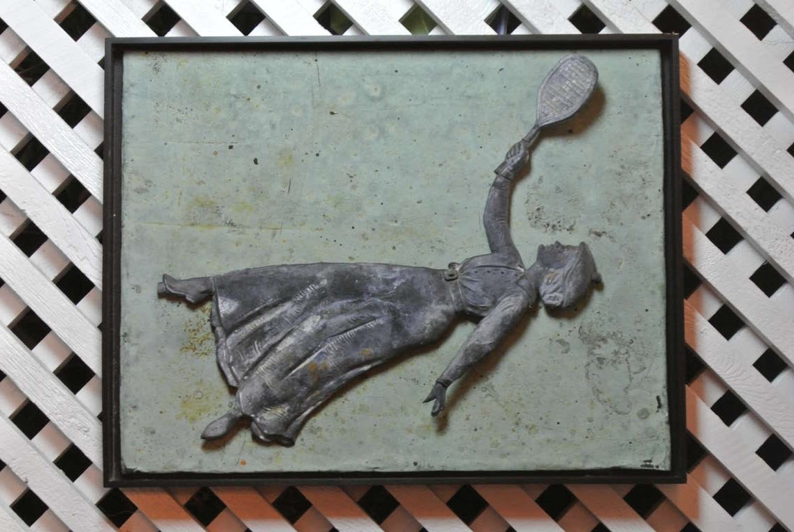 Antique tennis player weathervane mounted as wall hanging. Zinc tennis player on verdi gris copper back ground in black painted wood frame.