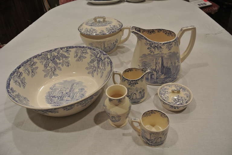 Lovely and complete blue and white transfer ware set for bedroom. There is chamber pot with lid, large basin with pitcher, vase, mug, covered soap dish and small pitcher, all of the same pattern. Seven pieces with two matching lids.