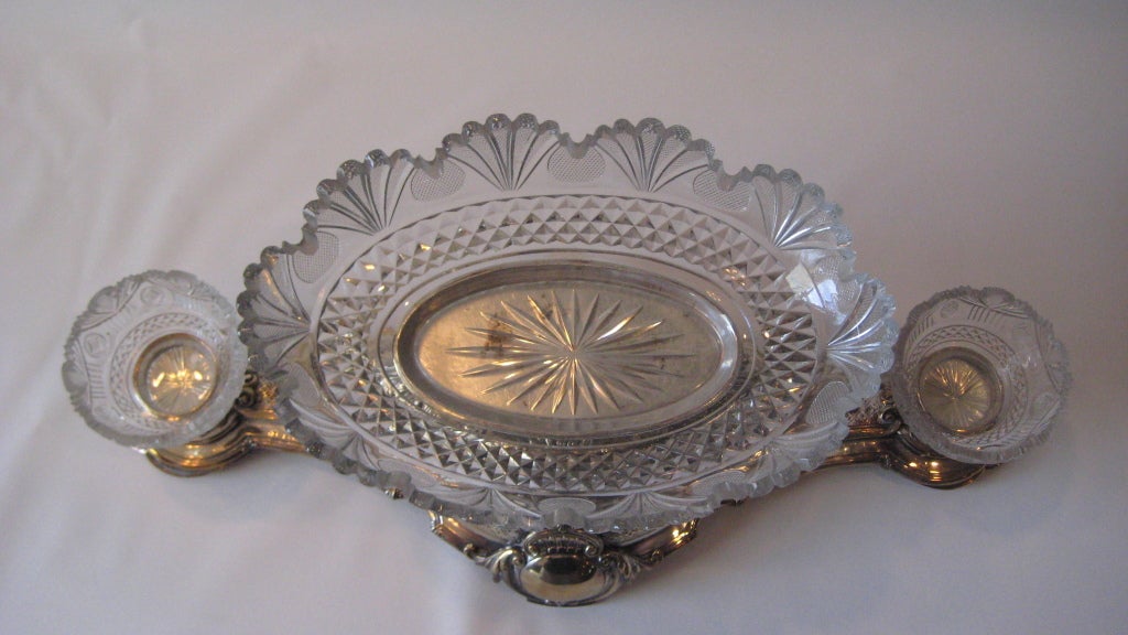 Victorian silverplate and crystal epergne with three dishes, by Elkington and Company. Made circa 1860.