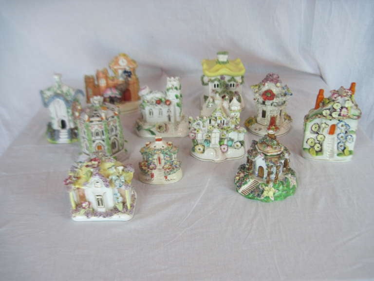 This marvelous collection of porcelain pastille burners are from England and were used to scent the room with pill sized aromatic insense. There is much minute detail to evoke the sense of a quaint village. There are  cottages and churches with