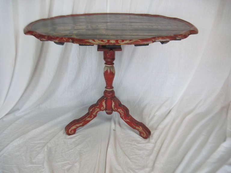 Painted and decorated 19th century tilt top breakfast table. Handsome proportions and elegant decoupage are highlights of this rare original. Tilts upright for display.