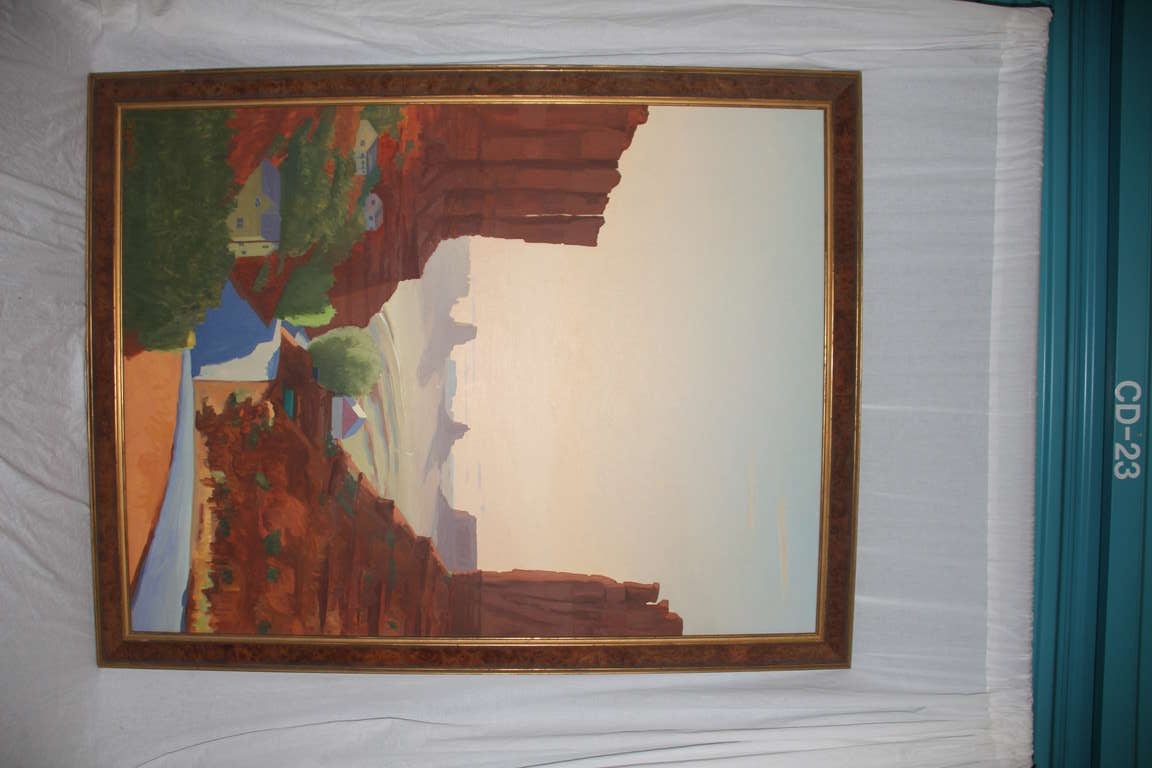 Impressive painting of Monument Valley in bright, clear earth tones with pastel sky. Signed Mason 95 on lower left corner. Custom frame with burl wood inlay edged in gold leaf.
