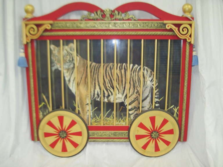 Gouache painting of lion by artist Karen Kirk Shields in an artist made dimensional painted wood circus wagon.  Signed and dated in lower center (1999).