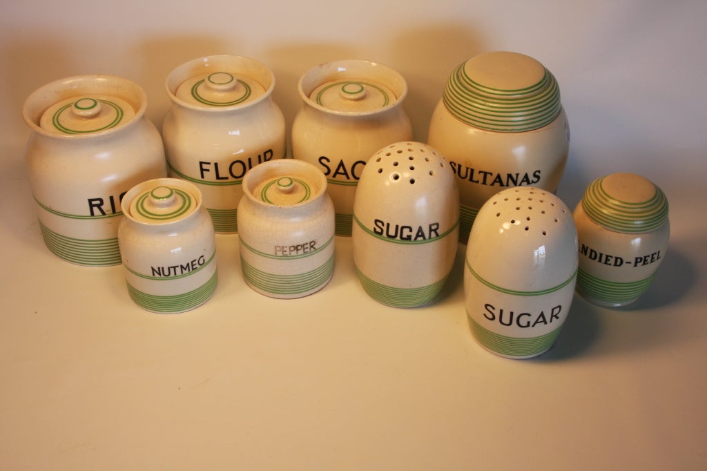 Kleen Kitchen Ware stamped canister set. Comprising Rice, Flour, Sultanas, Sago, 2 Sugar shakers, Candied Peel, Pepper, and Nutmeg canisters. Measurement is for the Rice Canister