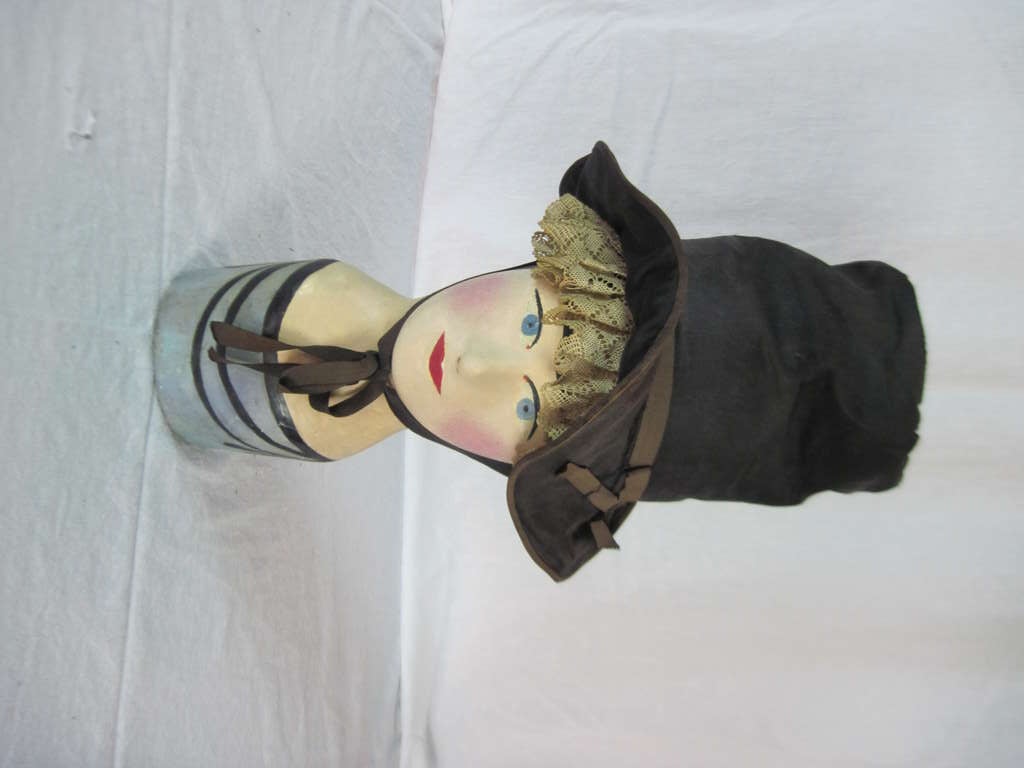 Set of three antique wig stands from the Howard Kaplan Collection.  Each stand featuring original black mourning bonnets. all very similar in size and shape.they show age and patina. Each of these measure about 22