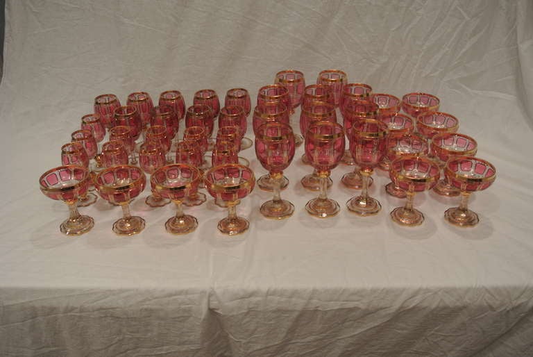 Bohemian Cranberry and Gilt Overlay Stemware Service In Excellent Condition For Sale In West Palm beach, FL