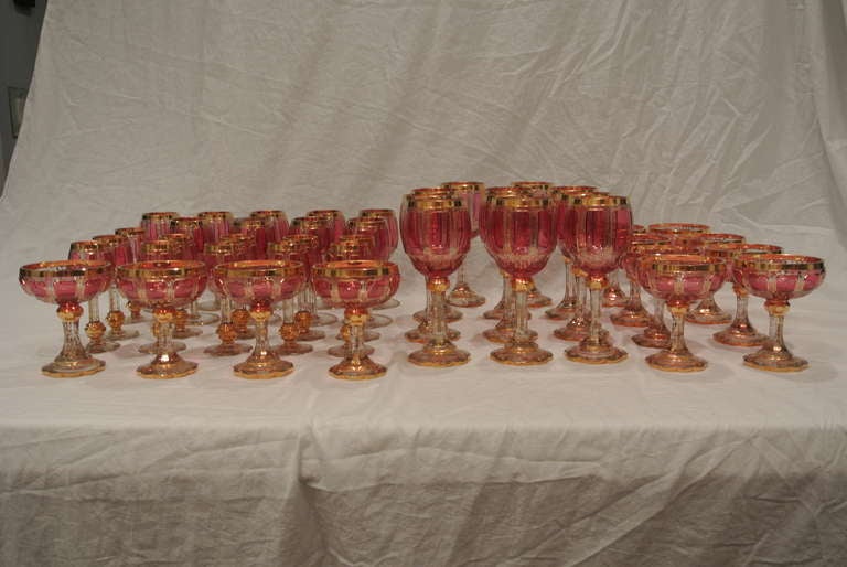 German Bohemian Cranberry and Gilt Overlay Stemware Service For Sale