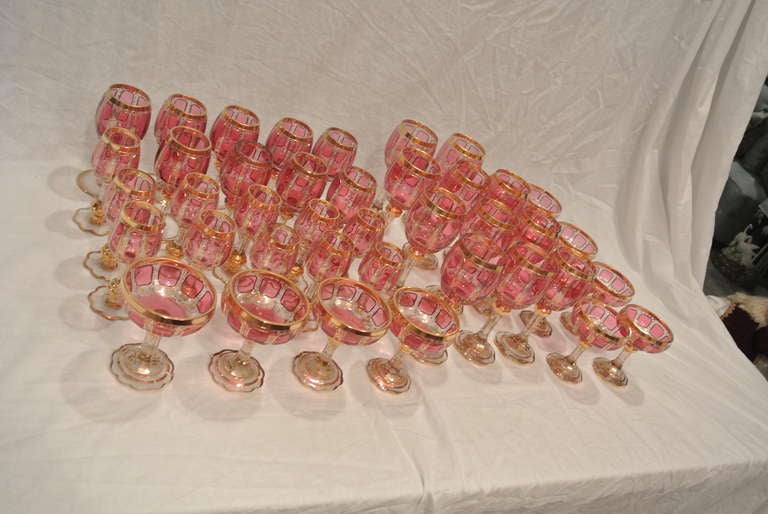 Bohemian Cranberry and Gilt Overlay Stemware Service For Sale 3