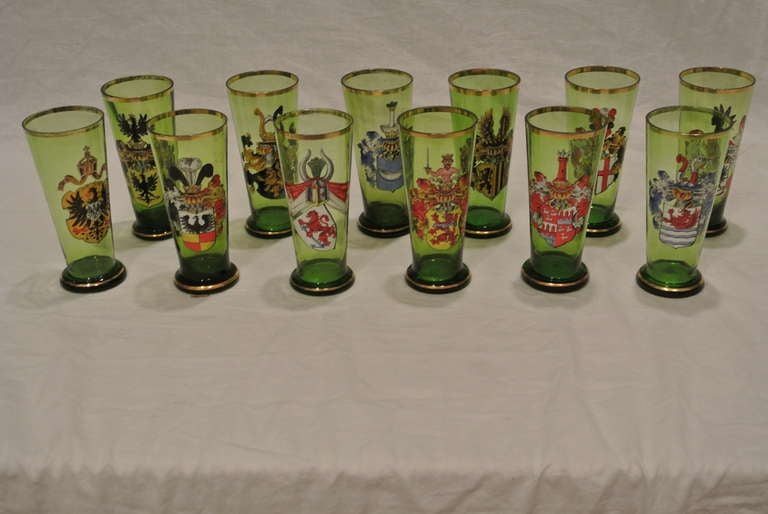 Twelve Bohemian Enameled and Gilt Green Glass Pilsners