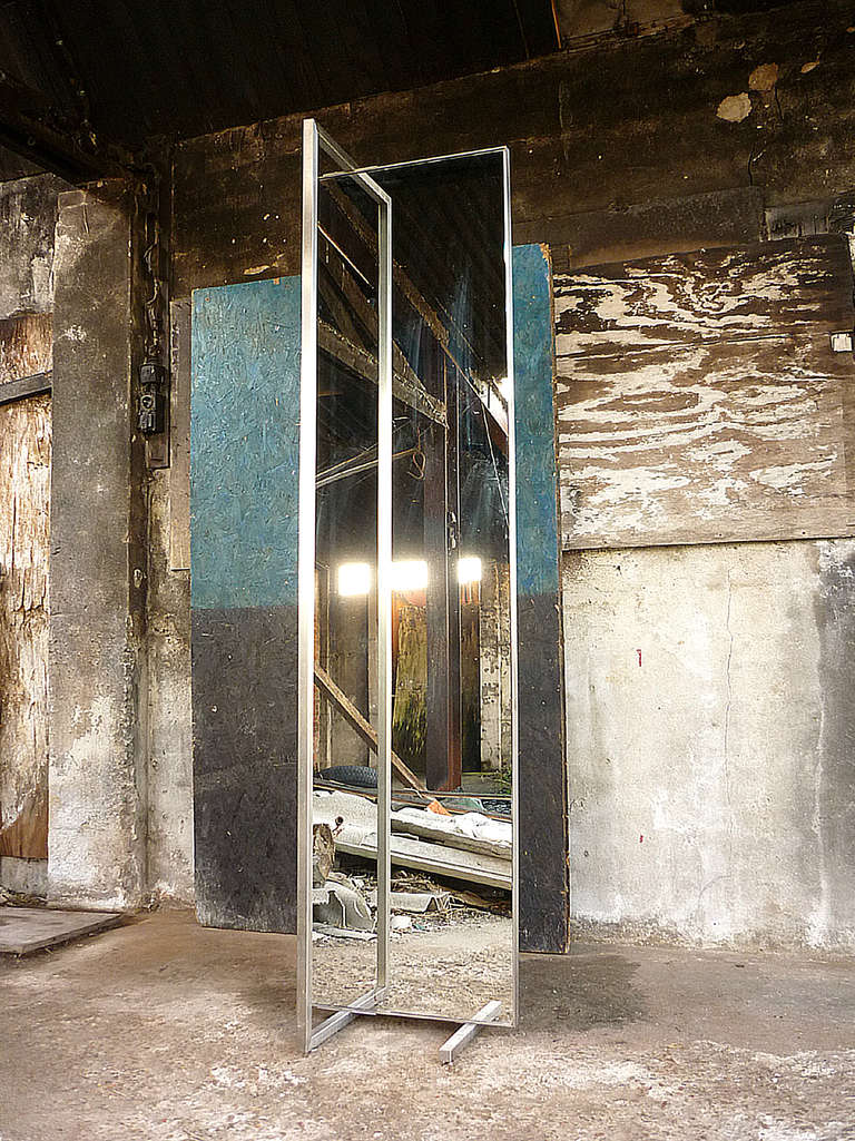 Monumental and Bauhaus inspired floor mirror from the late 1950's. Nice hard-cut lines which makes this mirror 