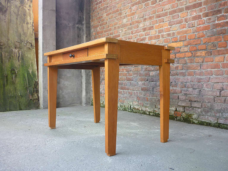 Fantastic French modernist writing desk. This desk is a crossover of Charlotte Perriand and Pierre Jeanneret with a sprinkle of Lloyd Wright. The downside of the feet are still art deco and the upper, especially the corners, is more modernistic.