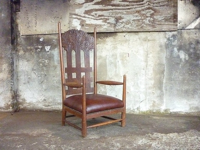 Fantastic arts & craft high backed chair strongly influenced by- or a precursor of Charles Rennie Mackintosch. The carved out trees have the same shape as the well known High Backed chair for Miss Cranston’s Tea Rooms in Argyle Street, Glasgow. As