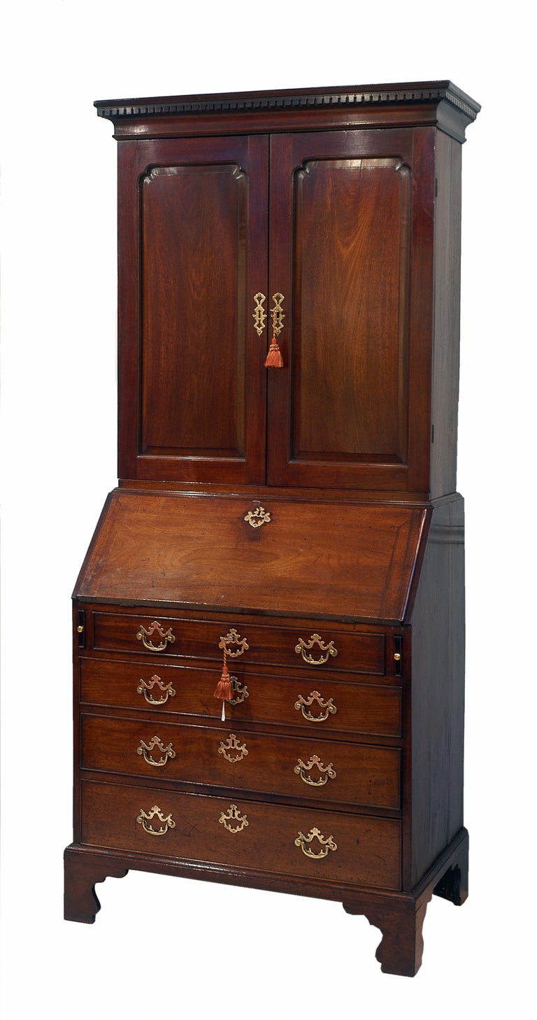 A Fine George II Period Mahogany Bureau Bookcase
Having Fielded Panelled Doors To Top Above Well
Figured Fall And Four Long Drawers With Original
Open Plate Handles Standing On Original Bracket Feet.