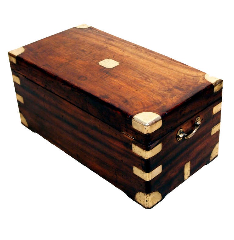 A Delightful Mid 19th Century Camphor Wood Military Campaign
Trunk Of Diminutive Proportion Having Original Brass Bound
Decoration And Carrying Handles