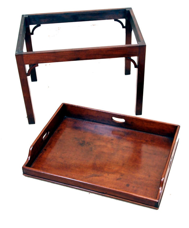 An Attractive George III Period Mahogany Butlers Tray Having
Shaped Sides And Pierced Carrying Handles Housed On Later
Mahogany Square Leg Stand