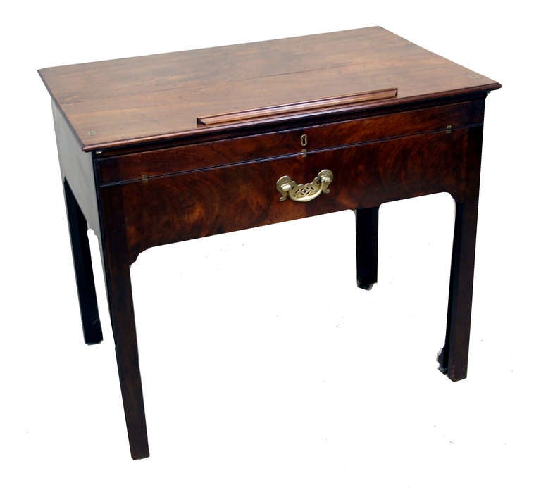 A Superbly Patinated George II Period Mahogany Architects 
Table Having Well Figured Folding & Ratcheted Top Above Frieze 
Drawer With Original Pierced Brass Handle, Fitted With Leathered 
Writing Surface & Detachable Slope Concealing Interior