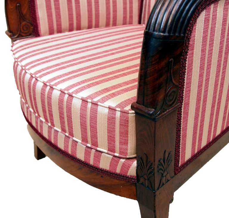A fine quality mahogany French Empire library armchair having
swept arms with moulded decoration raised on elegant sabre
legs.