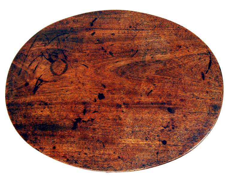 A regency mahogany wine table having well figured
oval top above elegant turned column terminating
on umbrella tripod base.