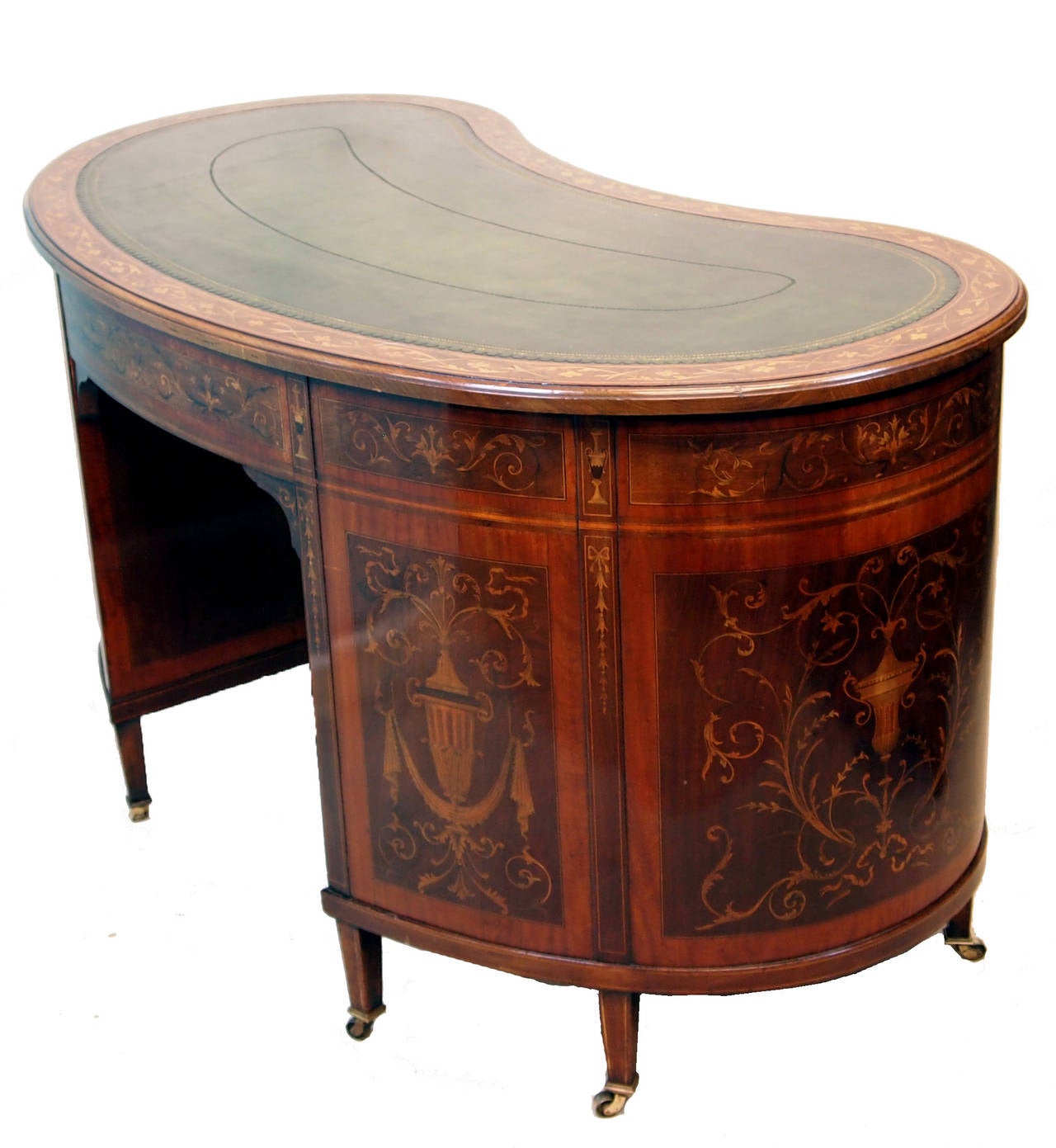A Magnificent Quality Late 19th Century Mahogany Kidney Shaped 
Desk, The Leather Inset Top With Marquetry Inlaid Banding, Above 
Nine Marquetry Inlaid Drawers With Original Brass Handles Raised 
On Elegant Square Tapered Legs