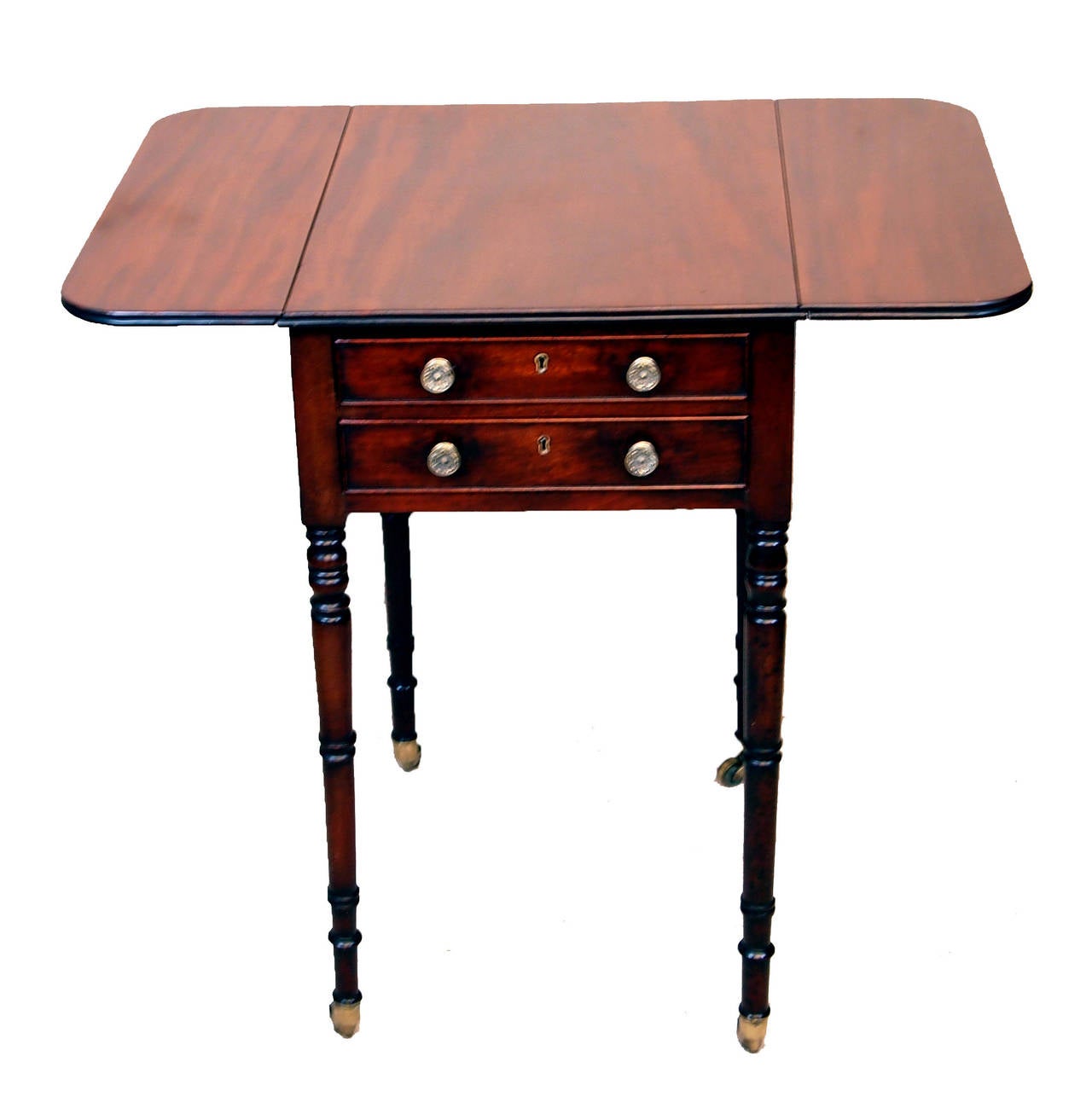 A very good quality Regency period mahogany baby 
Pembroke table having well figured top with two flaps 
above two frieze drawers, opposed by two dummy drawers 
to reverse side, raised on elegant turned legs and brass castors.

Measures: H